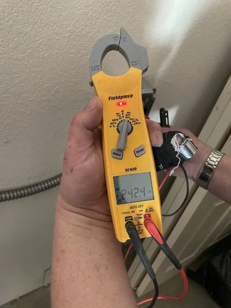 Voltage testing with clamp meter during Generator Installation in Rancho Santa Margarita